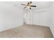 Spacious bedroom with carpet flooring and a ceiling fan for added comfort at 409 S Audubon Ave # 3, Tampa, FL 33609