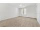 Bright bedroom with carpet flooring, ceiling fan, and a window to let the sun shine in at 409 S Audubon Ave # 3, Tampa, FL 33609