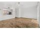 Spacious living room boasts wood-look floors, large windows, and an open layout for modern living at 409 S Audubon Ave # 3, Tampa, FL 33609