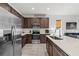 Modern kitchen with stainless appliances, stylish cabinetry, and a view into the comfortable living space at 4206 W North B St # 1, Tampa, FL 33609