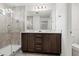 Stylish bathroom featuring a dual sink vanity, a spacious shower with tile walls and flooring at 4206 W North B St # 2, Tampa, FL 33609