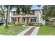 Well-manicured front lawn leads up to the charming home with colorful landscaping at 4206 W North B St # 2, Tampa, FL 33609