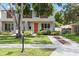 Inviting townhome featuring a well-maintained front yard and modern architectural details at 4206 W North B St # 2, Tampa, FL 33609