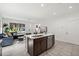 Open-concept kitchen with eat in island seamlessly flowing into the living room, perfect for entertaining at 4206 W North B St # 2, Tampa, FL 33609