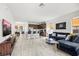 Bright, open-concept living room with tiled floors seamlessly connects to the modern kitchen at 4206 W North B St # 2, Tampa, FL 33609