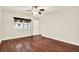 Bright bedroom with wood floors, window and white trim at 4342 Candler Ave, Spring Hill, FL 34609