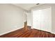 Bedroom featuring wood floors, closet, and natural light at 4342 Candler Ave, Spring Hill, FL 34609