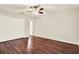 Bedroom featuring wood floors, closet, and ceiling fan at 4342 Candler Ave, Spring Hill, FL 34609