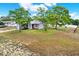 Charming single-story home with mature landscaping and a driveway at 4342 Candler Ave, Spring Hill, FL 34609