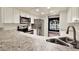 Bright kitchen with white cabinets, stainless steel appliances, and granite countertops at 4342 Candler Ave, Spring Hill, FL 34609