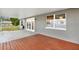 View of the patio with french doors and a window at 4342 Candler Ave, Spring Hill, FL 34609