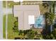 Aerial view showcasing the home's layout, pool area, and well-maintained landscaping at 460 Meravan Dr, Palm Harbor, FL 34683