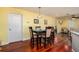 Bright dining area with hardwood floors, seating for four, and easy access to kitchen and living areas at 460 Meravan Dr, Palm Harbor, FL 34683