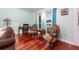 Comfortable sitting area with natural light and hardwood floors, perfect for reading or relaxation at 460 Meravan Dr, Palm Harbor, FL 34683