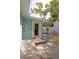 Back patio with a door to the house, storage bench, and a view of the yard at 4830 47Th N Ave, St Petersburg, FL 33714