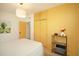 Bedroom with yellow accents, ample closet space and an adjacent view to the hallway at 4830 47Th N Ave, St Petersburg, FL 33714