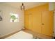 Bedroom featuring custom wardrobe, wooden floors, and modern light fixture at 4830 47Th N Ave, St Petersburg, FL 33714