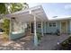Exterior features a spacious carport with a decorative trellis and inviting entrance at 4830 47Th N Ave, St Petersburg, FL 33714
