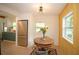 Bright dining nook features table with view to the kitchen with stainless steel refrigerator at 4830 47Th N Ave, St Petersburg, FL 33714
