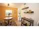Cozy dining nook with wood table, chairs, vintage decor, and natural light at 4830 47Th N Ave, St Petersburg, FL 33714