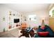 Bright living room with built-in shelving, modern decor, and large windows at 4830 47Th N Ave, St Petersburg, FL 33714