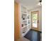 Entryway featuring built-in shelving, designer tile, and an exterior door at 4830 47Th N Ave, St Petersburg, FL 33714