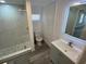 Updated bathroom with walk-in shower, modern vanity, and stylish fixtures at 4851 W Gandy Blvd # B10L30, Tampa, FL 33611
