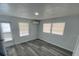 Light-filled bedroom with modern gray flooring, neutral walls, and ample natural light at 4851 W Gandy Blvd # B10L30, Tampa, FL 33611