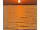 Stunning sunset view over the water, with the sun reflecting on the calm surface at 4851 W Gandy Blvd # B10L30, Tampa, FL 33611