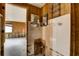 Bathroom leading into living room showcasing potential for redesign and modernization at 5290 Cyril Dr, Dade City, FL 33523