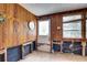 Entrance area with wood paneling, natural light, awaiting restoration and personalization at 5290 Cyril Dr, Dade City, FL 33523