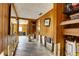 Hallway with wood paneling, offering access to other rooms at 5290 Cyril Dr, Dade City, FL 33523