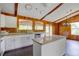 Kitchen with granite countertops, stainless steel appliances, white cabinetry and breakfast bar at 5290 Cyril Dr, Dade City, FL 33523