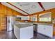 Bright kitchen with white cabinets, stainless steel appliances, and granite countertops at 5290 Cyril Dr, Dade City, FL 33523