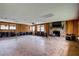 Spacious living room with a brick fireplace and natural light at 5290 Cyril Dr, Dade City, FL 33523