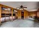 Living room featuring wood paneling, offering access to other rooms at 5290 Cyril Dr, Dade City, FL 33523