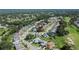 Aerial view of the property with mature trees, manicured lawns in a serene and well-maintained neighborhood at 5303 Cottonwood Tree Cir, Valrico, FL 33596