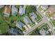 An aerial view displays many residences that have swimming pools, well manicured lawns and mature landscaping at 5303 Cottonwood Tree Cir, Valrico, FL 33596