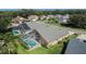 Aerial view of the property with a screened-in pool, lush landscaping, and mature trees at 5303 Cottonwood Tree Cir, Valrico, FL 33596