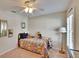 Inviting bedroom with ceiling fan, closet, and window, creating a comfortable personal space at 5303 Cottonwood Tree Cir, Valrico, FL 33596