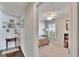 Bright bedroom featuring shuttered windows, a ceiling fan, and colorful decor with comfortable carpet flooring at 5303 Cottonwood Tree Cir, Valrico, FL 33596