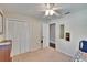 Practical bedroom with closet, ceiling fan and adjoining door at 5303 Cottonwood Tree Cir, Valrico, FL 33596