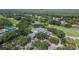 Aerial view featuring a well-manicured golf course and a luxurious clubhouse at 5303 Cottonwood Tree Cir, Valrico, FL 33596