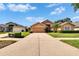 Inviting single-Gathering home with a spacious driveway, beautiful landscaping, and ample green space at 5303 Cottonwood Tree Cir, Valrico, FL 33596