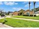Lovely single-Gathering home with a well-kept lawn and mature landscaping, offering classic curb appeal at 5303 Cottonwood Tree Cir, Valrico, FL 33596
