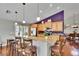 Open-concept kitchen with granite counters, stainless appliances, and bar seating overlooking living spaces at 5303 Cottonwood Tree Cir, Valrico, FL 33596