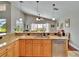 Bright kitchen featuring granite countertops, stainless steel appliances, and lots of natural light from a window at 5303 Cottonwood Tree Cir, Valrico, FL 33596