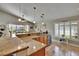 Bright kitchen featuring granite countertops, stainless steel appliances, and lots of natural light from a window at 5303 Cottonwood Tree Cir, Valrico, FL 33596
