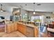 Bright kitchen featuring granite countertops, stainless steel appliances, a vaulted ceiling and lots of natural light at 5303 Cottonwood Tree Cir, Valrico, FL 33596