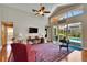 Inviting living room featuring vaulted ceilings, hardwood floors, and a view of the screened-in pool at 5303 Cottonwood Tree Cir, Valrico, FL 33596